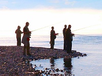 Men fishing from the shore of lake baikal