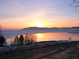 Tours to baikal: Listvyanka tours: Sunset in January. View from the Listvenichny cape at the end of the highway. Listvyanka.