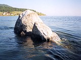 Tours to baikal: Listvyanka tours: Baikal - Shaman stone at the middle of the Angara river outlet